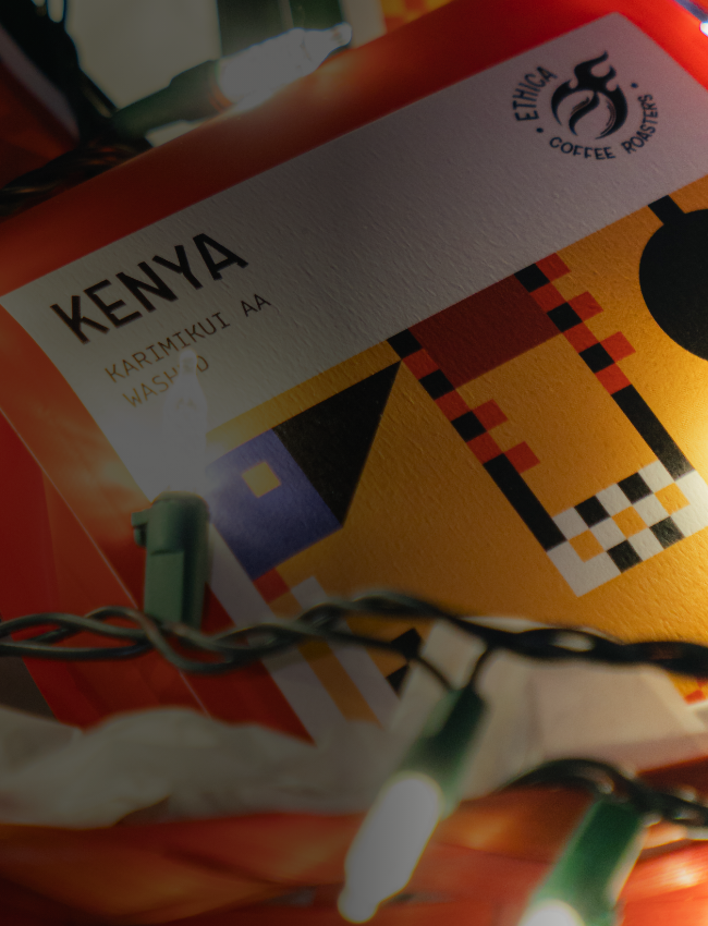 a bag of specialty coffee with christmas lights around it